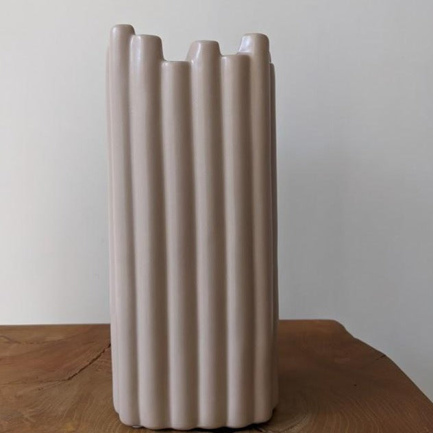 Ribbed ceramic vase in stone
